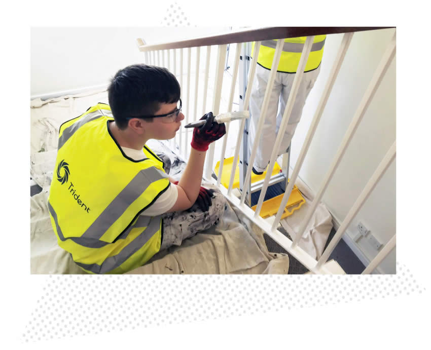 Workers painting stairs